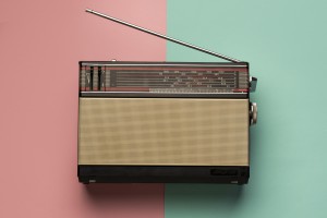 retro-broadcast-radio-receiver-pink-light-blue-background
